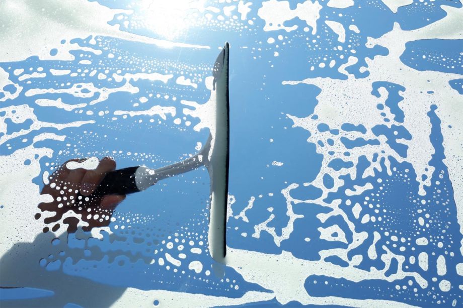 squegee cleanig a sun roof